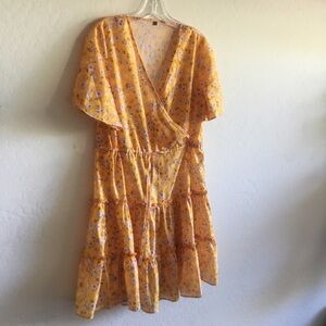 Yellow floral dress with string ties at waistband, ruffled. S